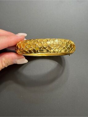 Coach Gold Hinged Enamel Signature Pattern Bangle Bracelet